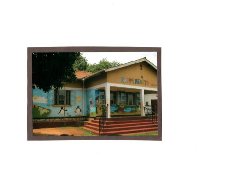 Yellow schoolhouse in Uganda.